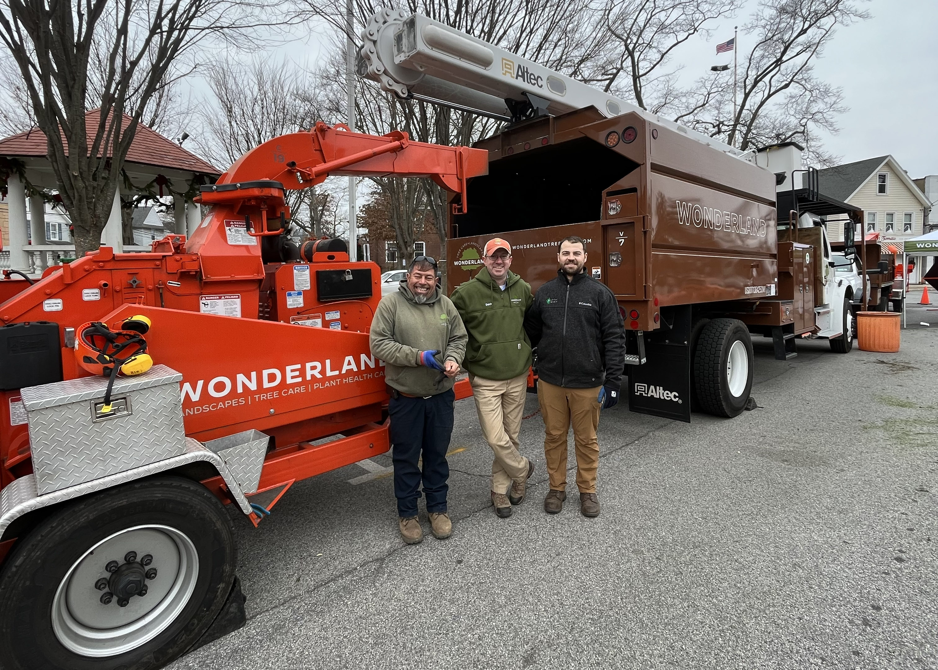 Wonderland Tree Care landscapers in front of landscaping equipment.